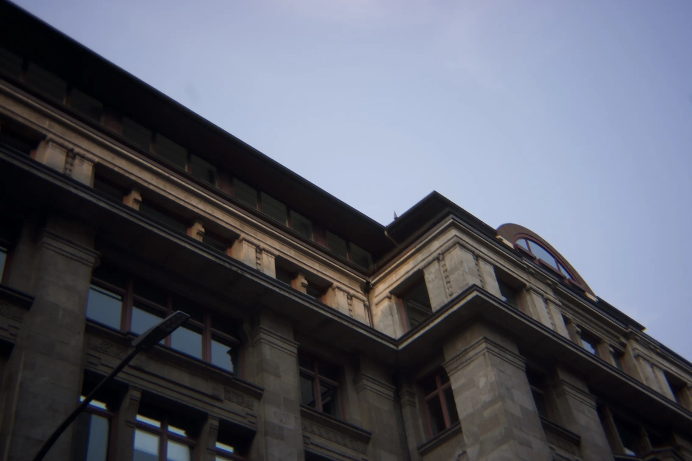 a house shot from below, it looks old